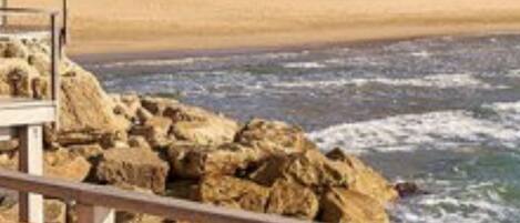 On the beach, sun loungers, beach towels