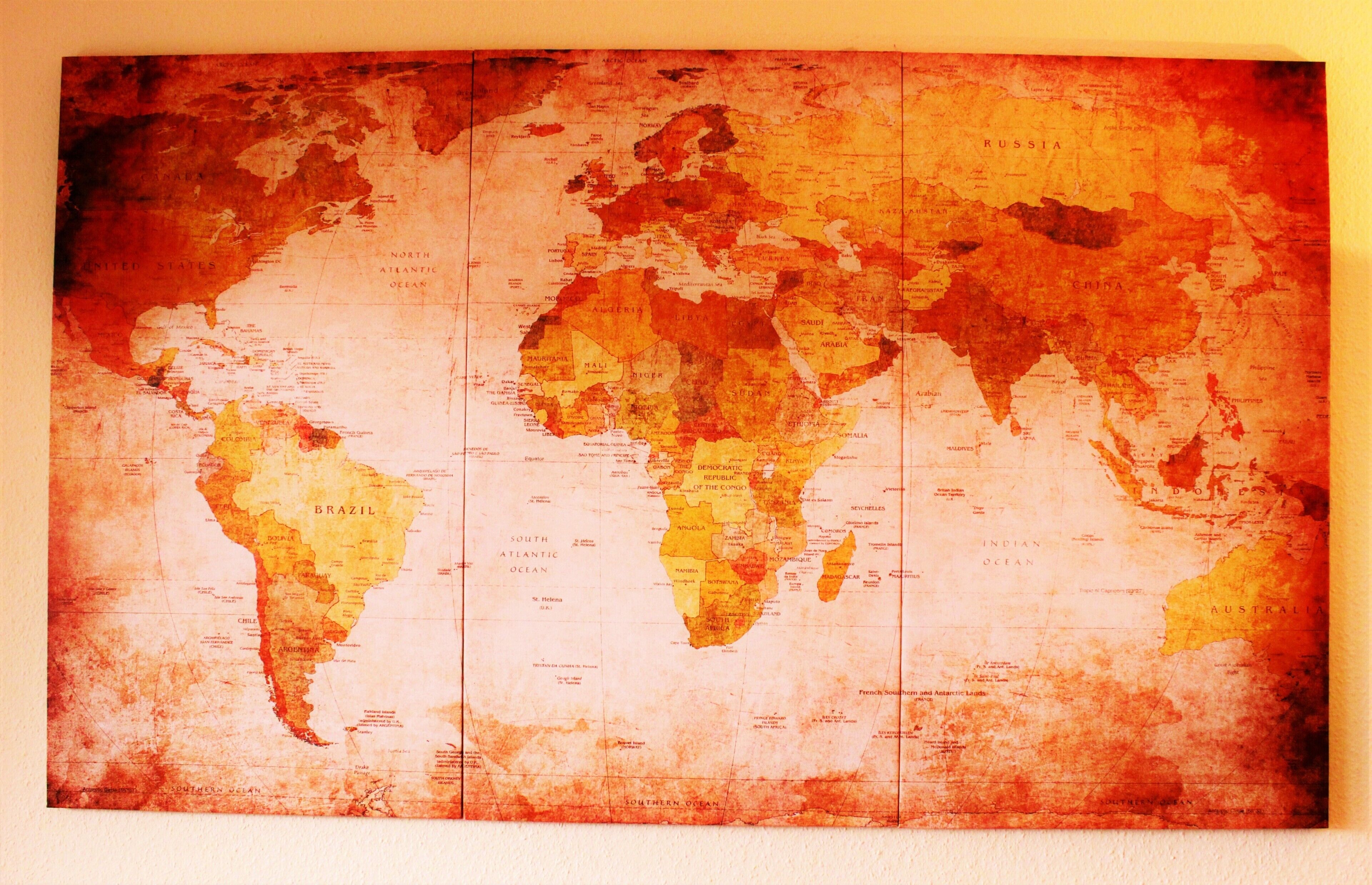 A vintage world map with continents labeled in a vintage style.