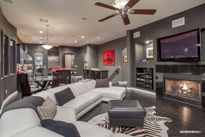 Smart TV, fireplace, books, stereo