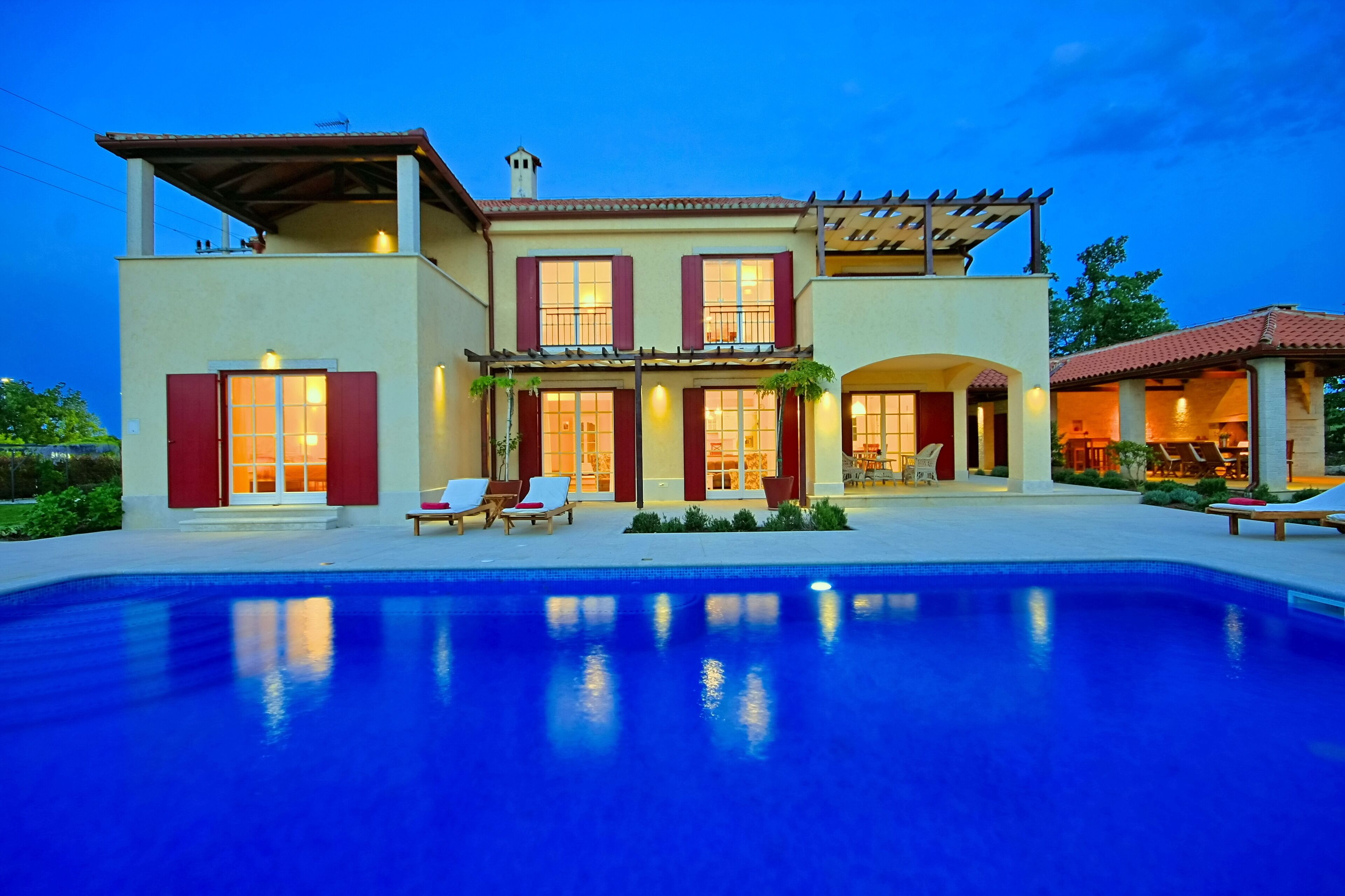 A heated pool, pool loungers