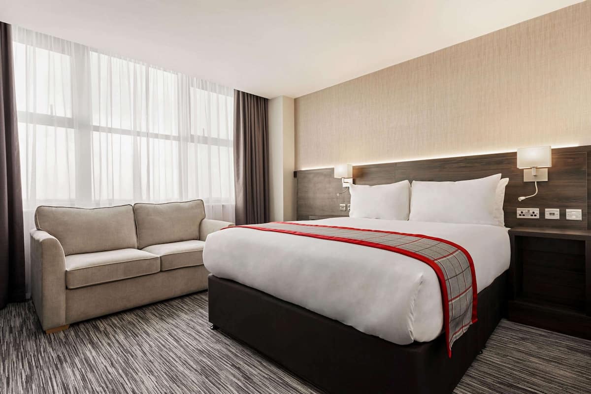 family room, 1 double bed with sofa bed, non smoking | 1 bedroom, in-room safe, desk, iron/ironing board