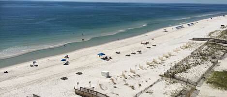 On the beach, sun loungers, beach towels