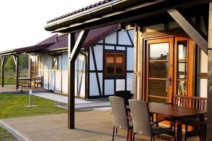 Outdoor dining - holiday home "House1" with water view (Sarbinowo)