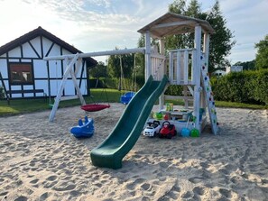 Children's area - holiday home "House1" with water view (Sarbinowo)