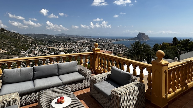 A balcony with wicker furniture and a view of a coastal cityscape. - Beautiful villa with private pool and exceptional sea views. VT-513857-A (Calpe)