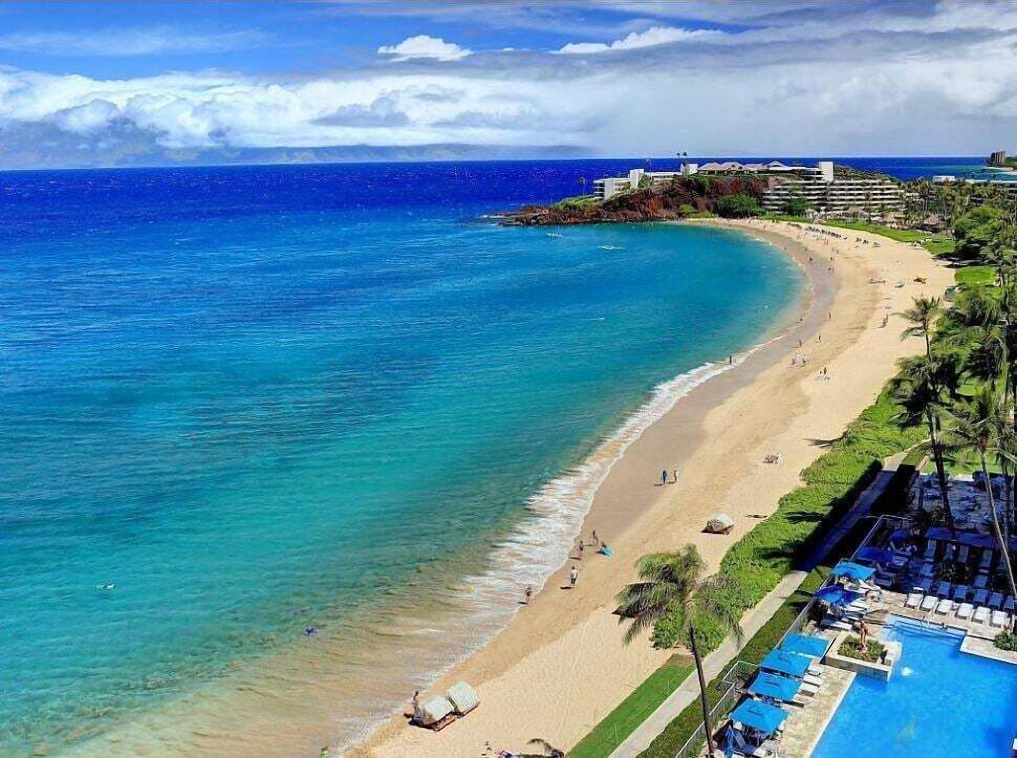 On the beach, sun loungers, beach towels