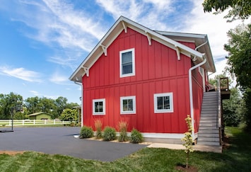 Welcome to The Barn at Haden. Exterior parking spot and staircase entry.