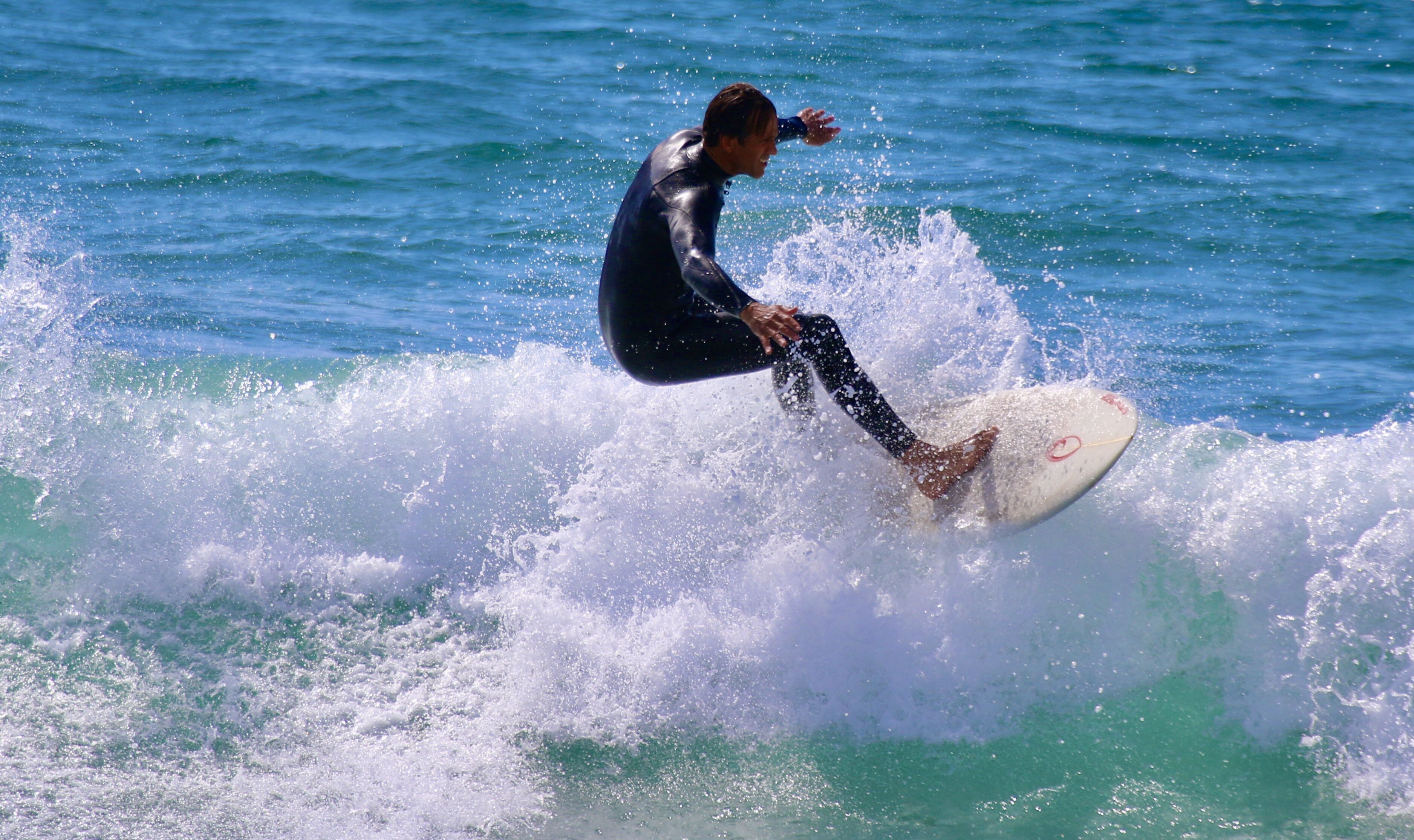 A person surfing on a wave.