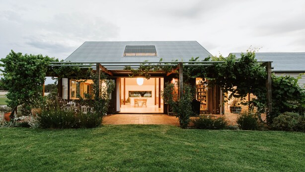 A modern house with a covered patio, a dining area, and a garden. - Abercorn - one of Stayz’s 2025 Holiday Homes of the Year (Buckaroo)