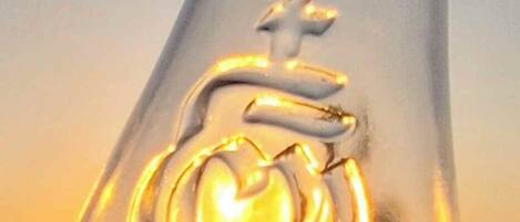 A clear view of a glass structure with a heart and cross emblem.