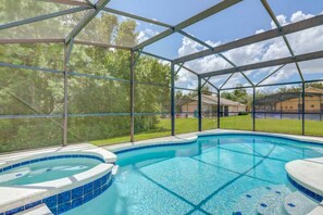 A covered outdoor swimming pool with a clear view of the surrounding landscape. - Sandy Ridge 678 (Davenport)