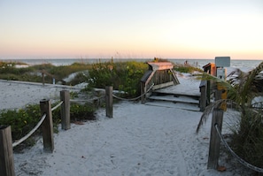 Walk along the beach to a secluded wooden shelter.