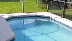 A swimming pool with a tiled edge and a clear blue water surface. - Wellington 132 (Davenport)
