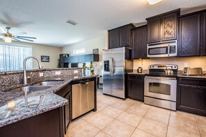 House, 6 Bedrooms | Private kitchen | Dishwasher, high chair, cookware/dishes/utensils - Cypress Pointe 1132 (Davenport)