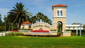 A sign for Calabay Parc with a tower, palm trees, and a well-maintained lawn. - Calabay Parc 215 (Davenport)
