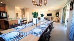 A modern kitchen with a dining area. - Golden Palms Vacation Resort 24444 (Kissimmee)