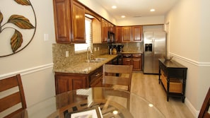 Condo, 2 Bedrooms | Private kitchen | Fridge, microwave, stovetop, dishwasher