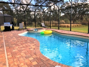 A swimming pool with a brick deck, a hot tub, and a grill area. - Golden Palms Vacation Resort 4439 (Kissimmee)