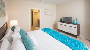 A bedroom with a bed, a nightstand, a dresser, and a wall decoration. - Laurel Estates 133 (Davenport)