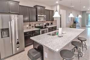 House, 6 Bedrooms | Private kitchen | Fridge, microwave, dishwasher, cookware/dishes/utensils - Windsor at Westside 1852 (Kissimmee)