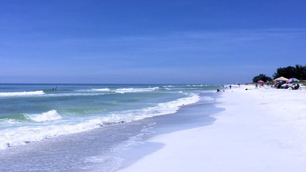 A beach with clear skies and calm waves. - Anna Maria Island 4102 - 10 (Holmes Beach)