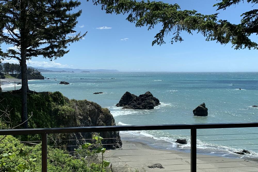 Pacific Edge Oceanfront Luxury Home with staircase to secluded sandy beach