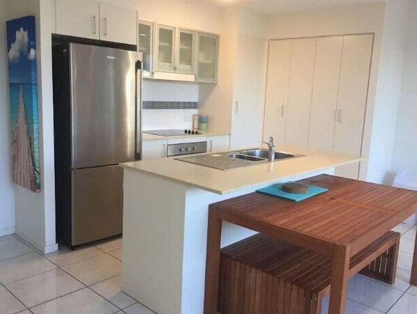 Family Apartment, 2 Double Beds, Pool View | Private kitchen | Full-size fridge, microwave, oven, stovetop
