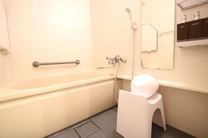 A bathroom with a bathtub, a shower, a toilet, and a sink.