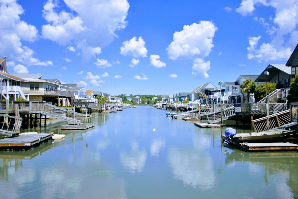 Large yard with water access & floating dock/kayak launch. One block from beach