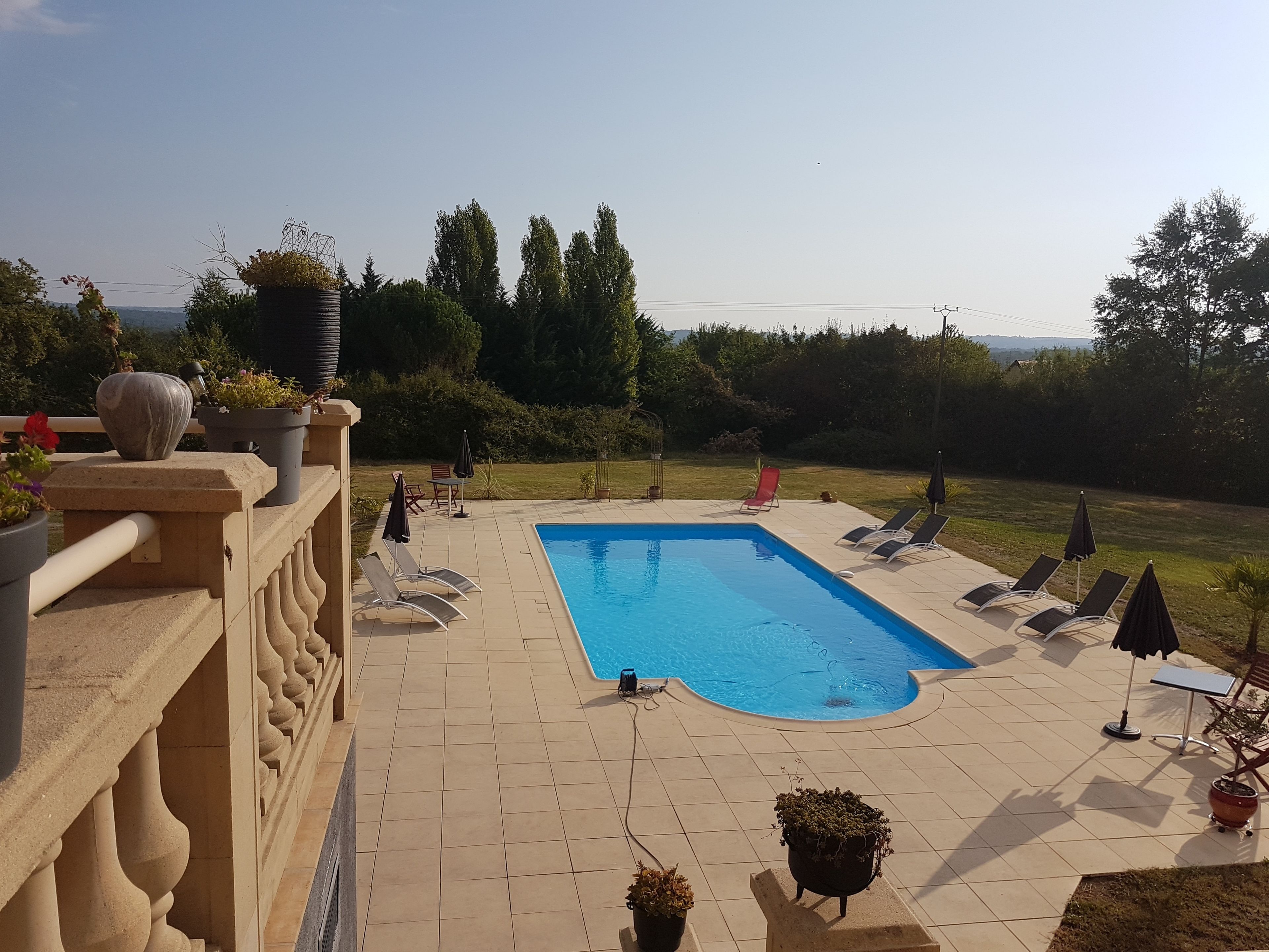 seasonal outdoor pool, pool umbrellas, pool loungers