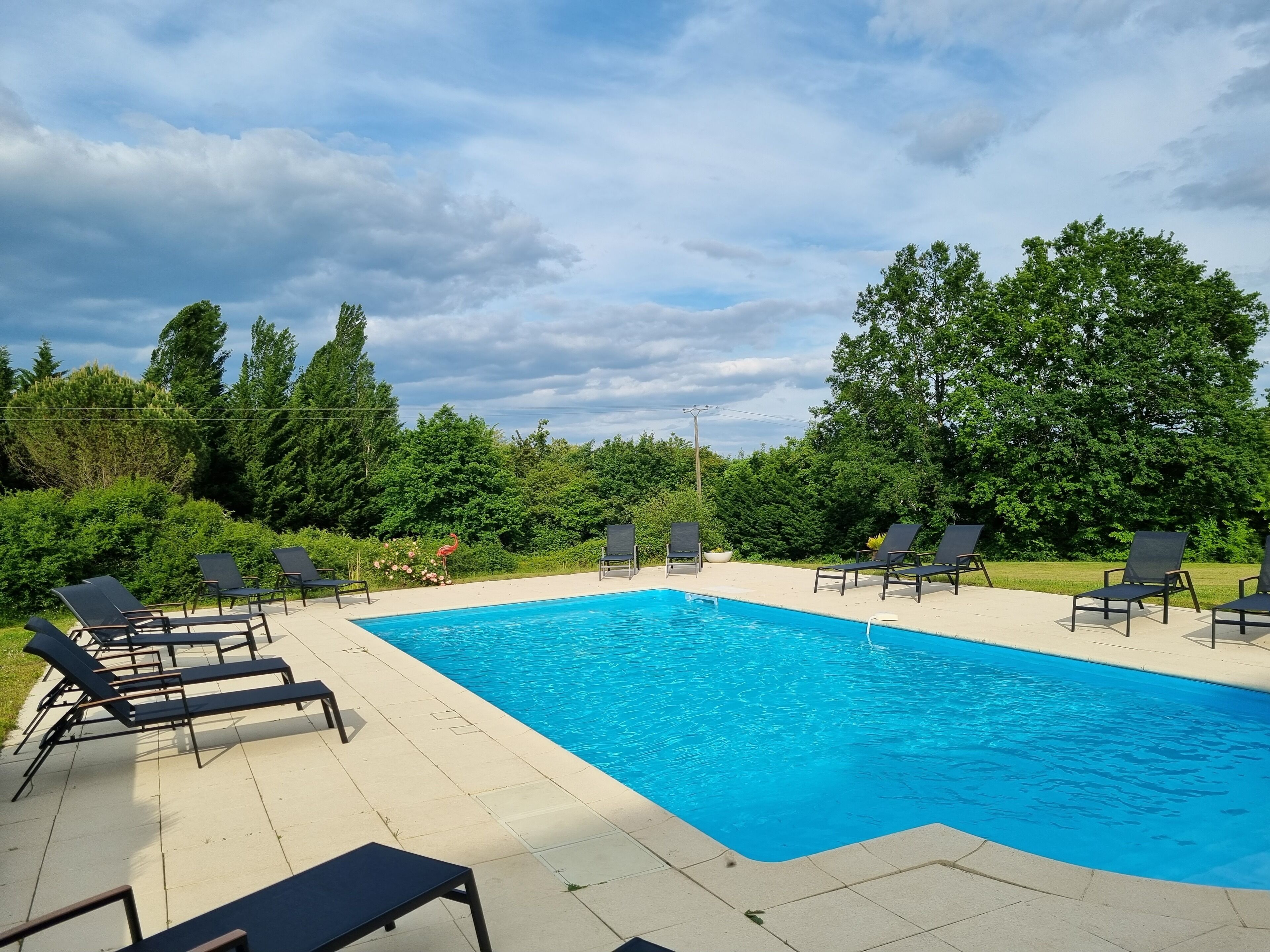 seasonal outdoor pool, pool umbrellas, pool loungers