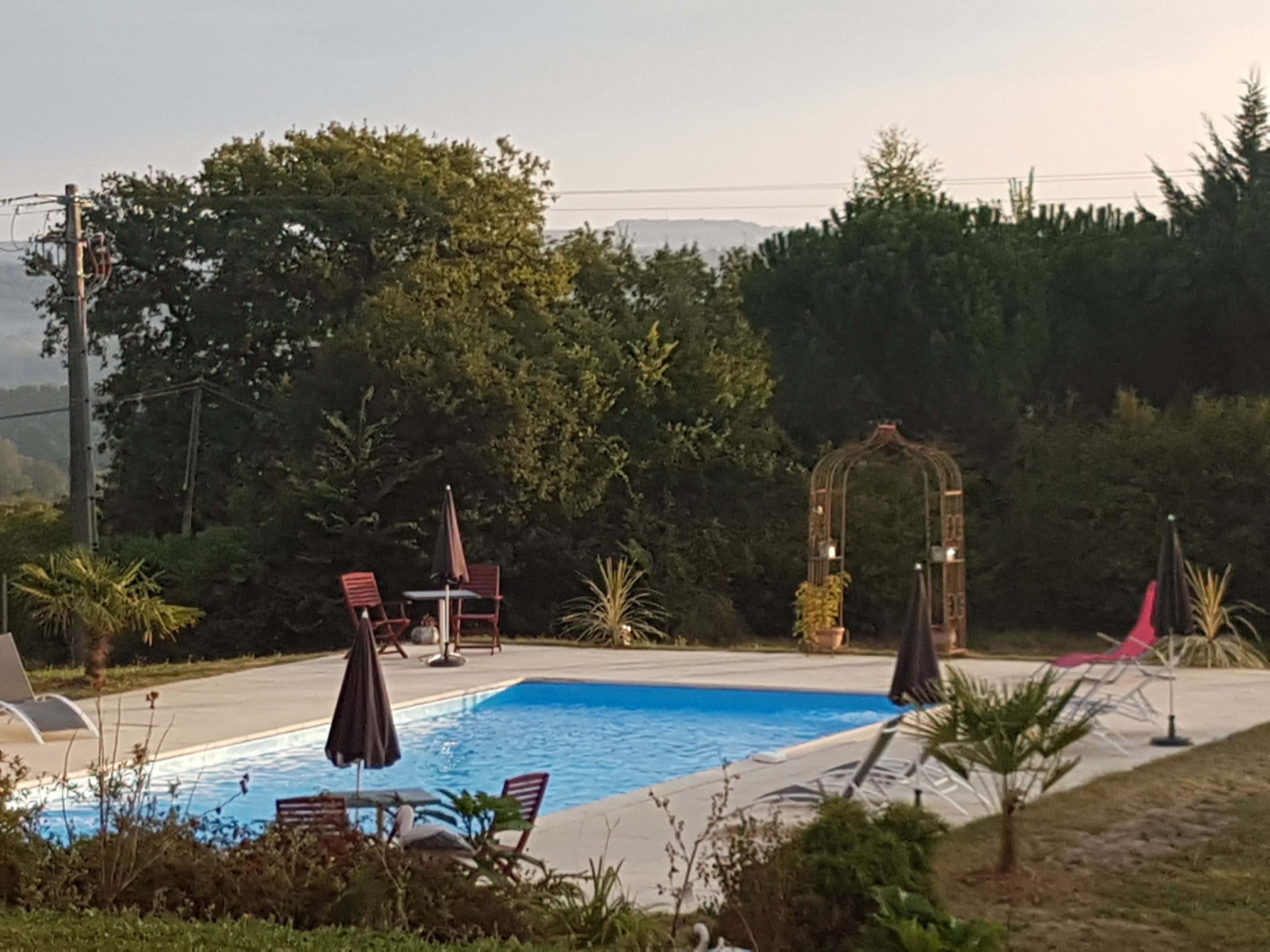 seasonal outdoor pool, pool umbrellas, pool loungers