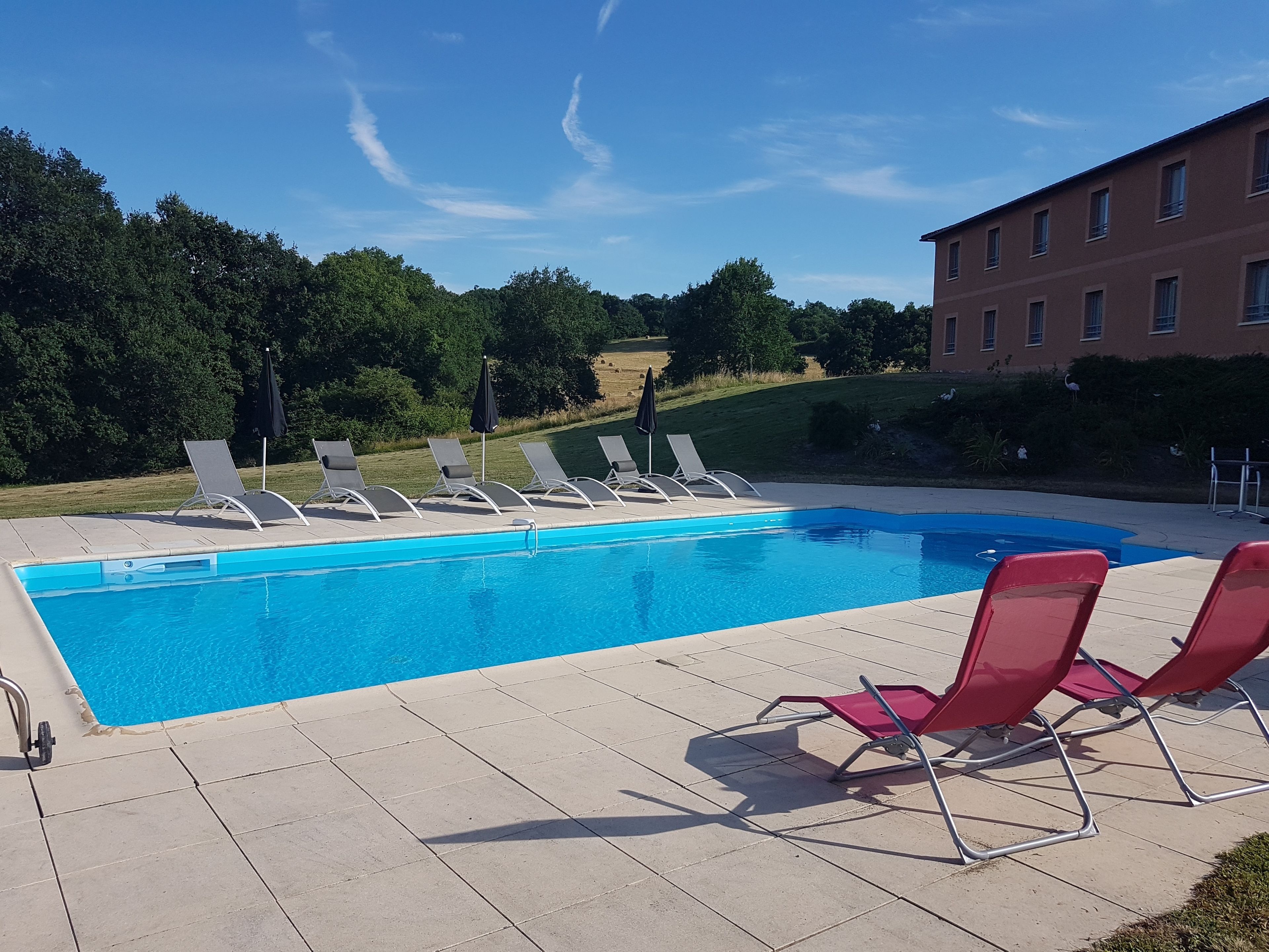 seasonal outdoor pool, pool umbrellas, pool loungers