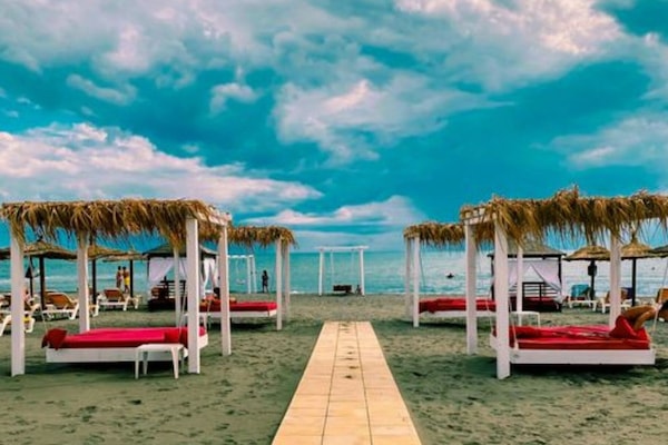 Sun loungers, beach umbrellas, beach towels, beach massages
