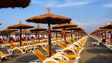Sun loungers, beach umbrellas, beach towels, beach massages