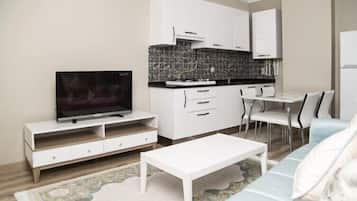 Suite familiar, 1 habitación | Cocina básica privada | Frigorífico grande, horno, placa de cocina y hervidor eléctrico