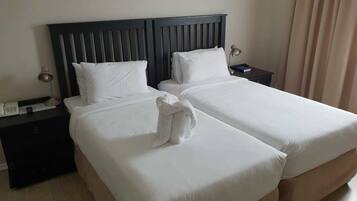 Family Room | Blackout drapes, bed sheets