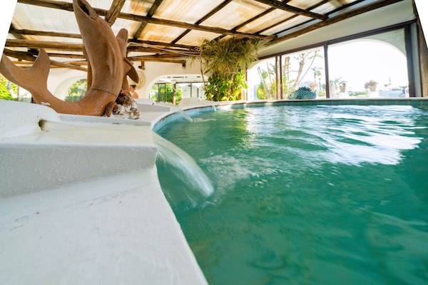 Indoor pool, seasonal outdoor pool, pool umbrellas, pool loungers