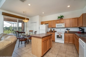 Enjoy meals in the kitchen with a dining area and large window offering a view of the outdoors.