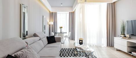 Appartement Deluxe | Coin séjour | Télévision à écran plat
