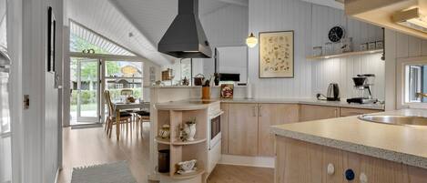 Fridge, stovetop, dishwasher, coffee/tea maker