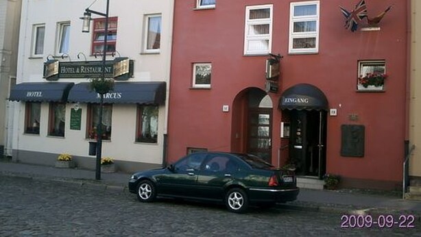 A hotel with a sign reading "Hotel & Restaurant" and a car parked in front. - Hotel-Restaurant Marcus (Malchin)