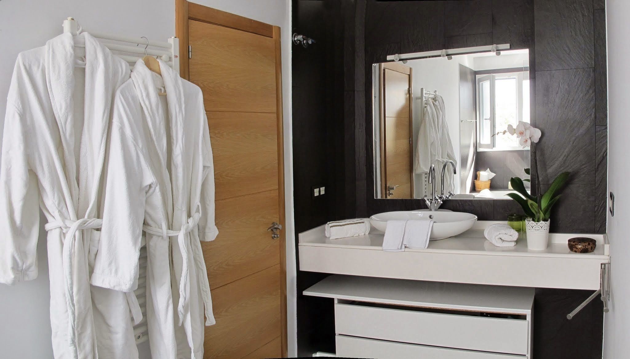 double or twin room | bathroom | deep-soaking bathtub, rainfall showerhead, free toiletries, bathrobes