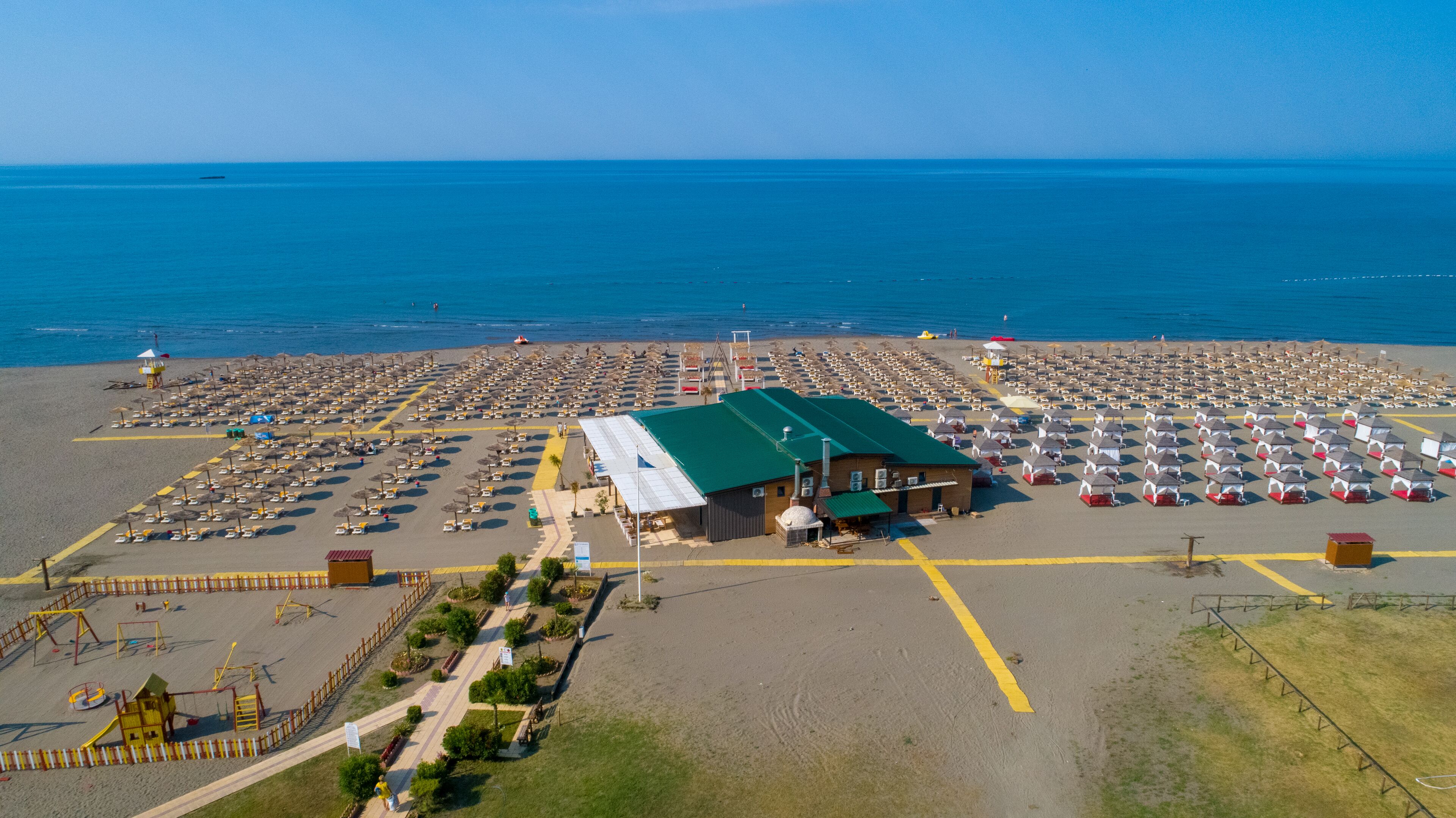 Private beach, white sand, sun-loungers, beach umbrellas