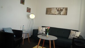 Suite, Non Smoking | Living area | Flat-screen TV
