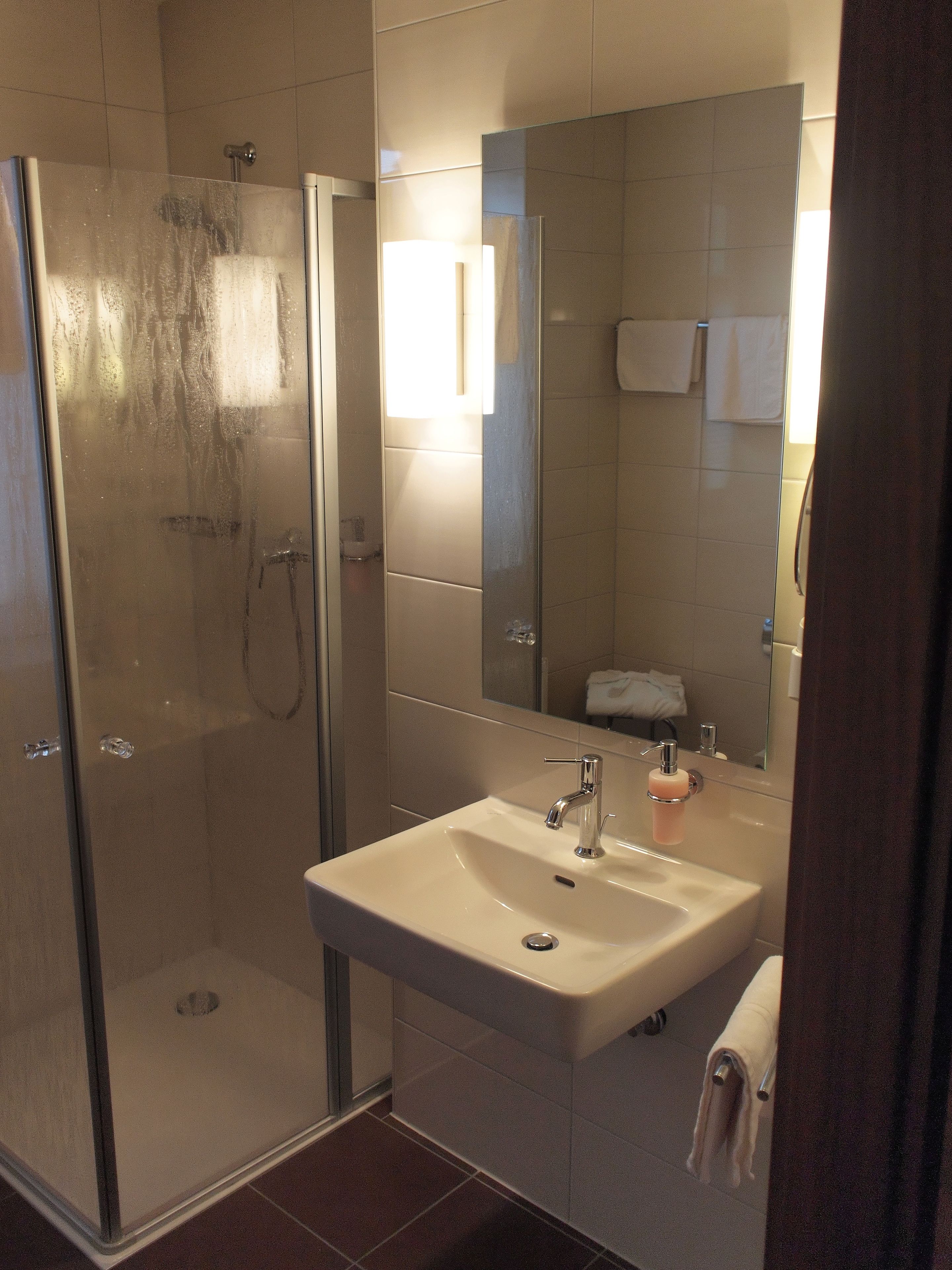 shower, free toiletries, hair dryer, towels