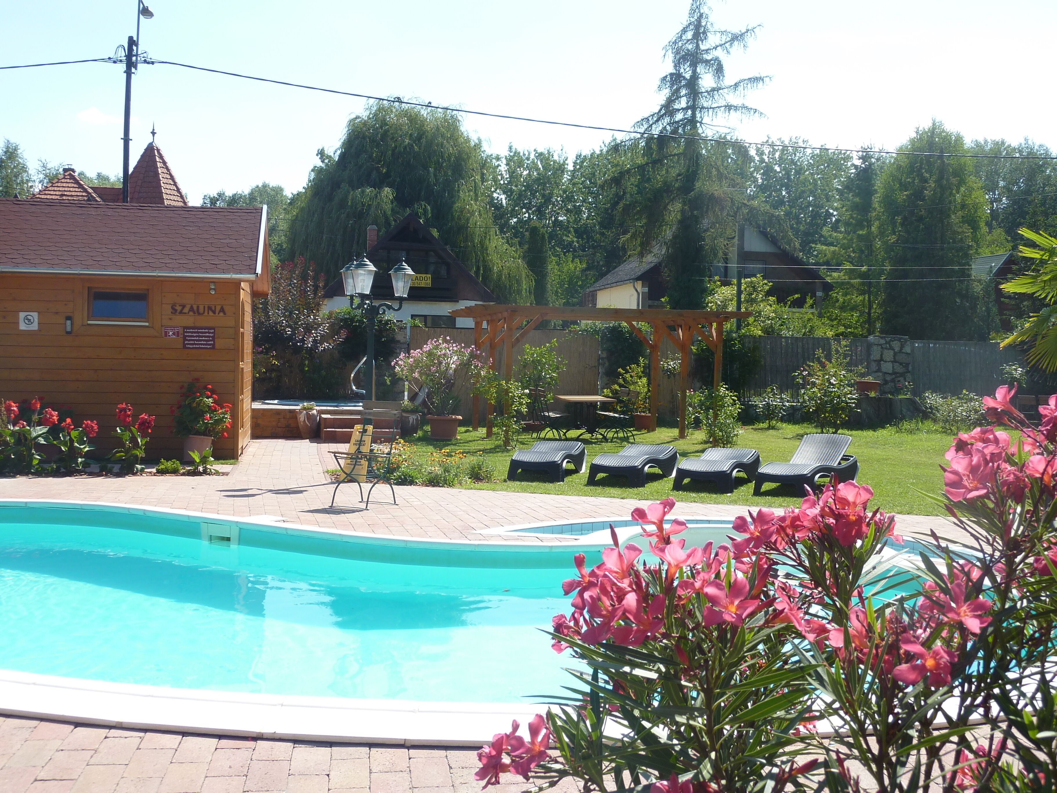 seasonal outdoor pool, pool umbrellas, pool loungers