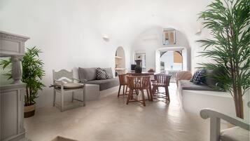 Grand Suite, 2 Bedrooms | Living room | Flat-screen TV