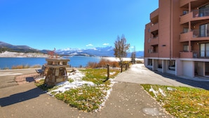 A building with balconies overlooking a lake and mountains. - 112 Marina Place 2 Bedroom Condo by RedAwning (Dillon)