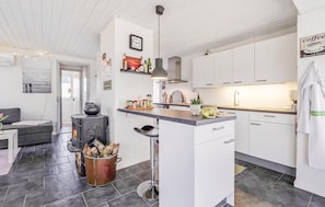 Fridge, stovetop, dishwasher, coffee/tea maker